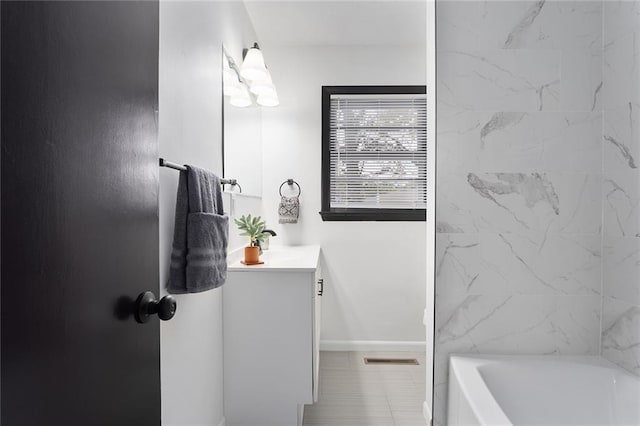 full bath with shower / bath combination, visible vents, baseboards, and vanity