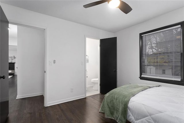 bedroom featuring ceiling fan, connected bathroom, baseboards, and wood finished floors