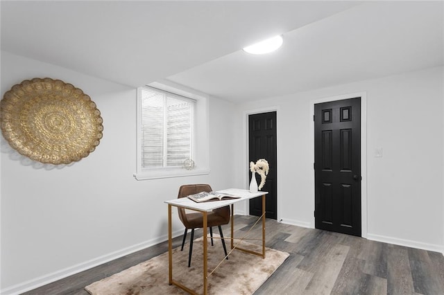 office space featuring baseboards and wood finished floors