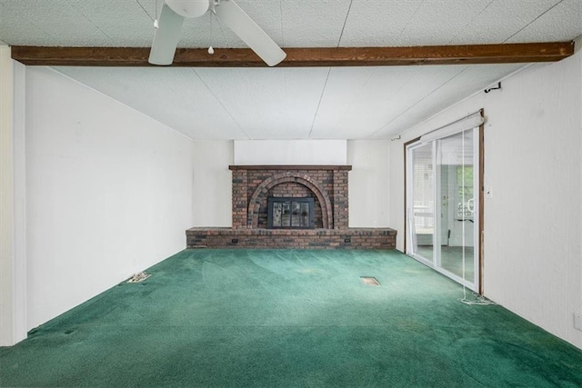24722 Tonganoxie Dr, Leavenworth, KS 66048 - unfurnished living room with carpet flooring, a ceiling fan, beam ceiling, and a fireplace