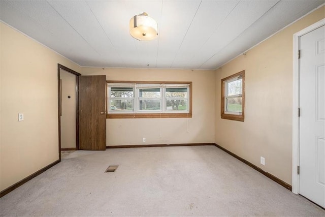 24722 Tonganoxie Dr, Leavenworth, KS 66048 - spare room with carpet flooring, visible vents, and plenty of natural light