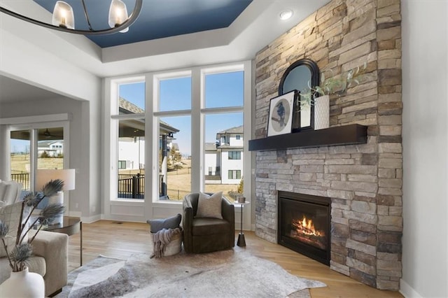 sitting room featuring plenty of natural light and wood finished floors