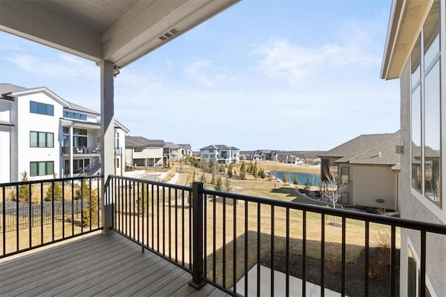 balcony with a water view and a residential view