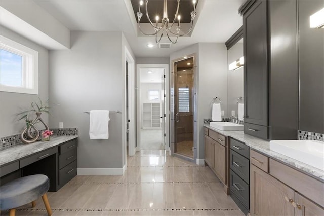 full bath featuring visible vents, a shower stall, vanity, and baseboards