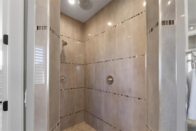 full bath with tiled shower