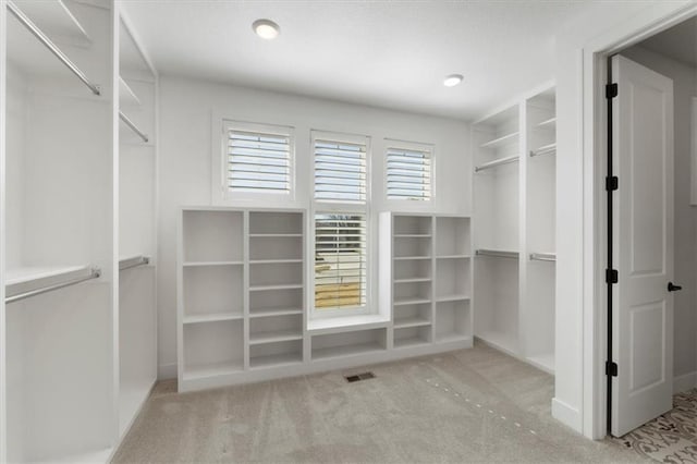 walk in closet with carpet and visible vents