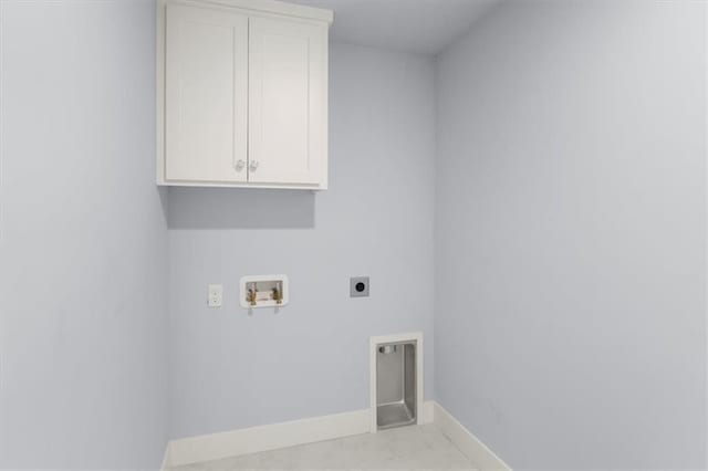 clothes washing area featuring hookup for a washing machine, hookup for an electric dryer, cabinet space, and baseboards