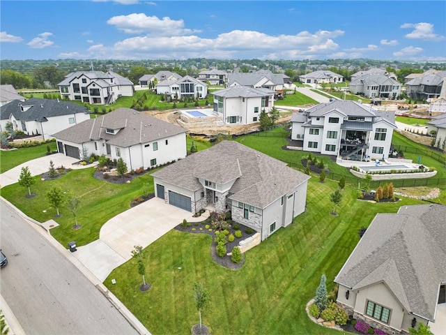 birds eye view of property with a residential view