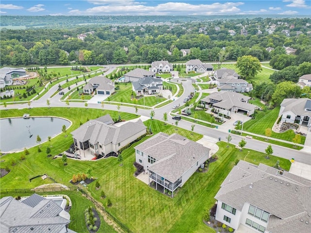 bird's eye view with a water view and a residential view