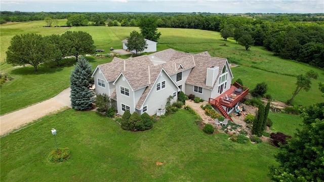 birds eye view of property with a rural view