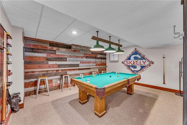 game room featuring a drop ceiling, recessed lighting, wood walls, carpet flooring, and baseboards