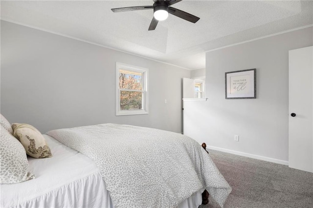 bedroom featuring baseboards, carpet, ornamental molding, and a textured ceiling