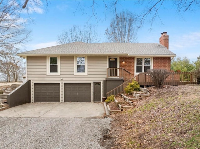 view of front of home featuring stairway, concrete driveway, roof with shingles, a chimney, and an attached garage