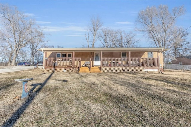 ranch-style house featuring a porch and brick siding