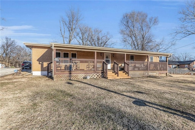 view of front of property with covered porch and brick siding