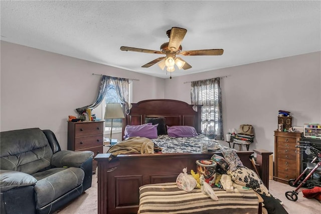 bedroom with light carpet and ceiling fan