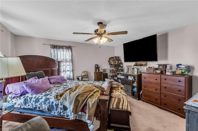 carpeted bedroom with a ceiling fan