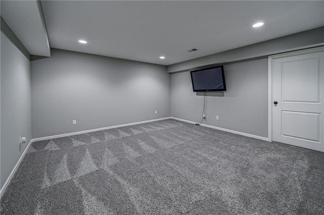 finished below grade area featuring recessed lighting, carpet, and baseboards