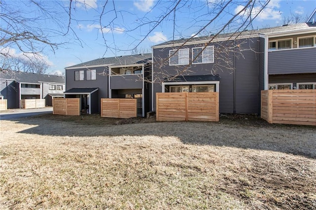 rear view of house with fence