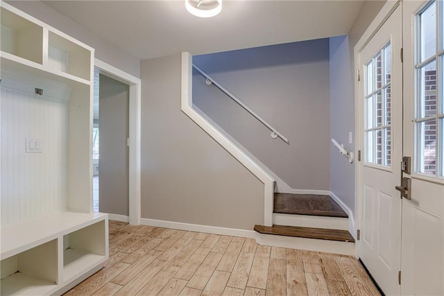 mudroom with light wood-type flooring and baseboards