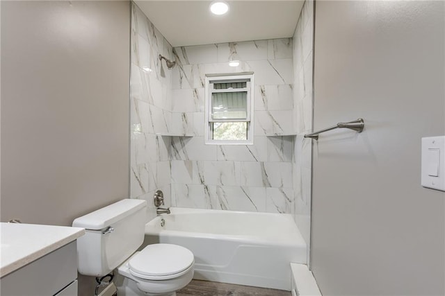 bathroom with toilet, tub / shower combination, and vanity