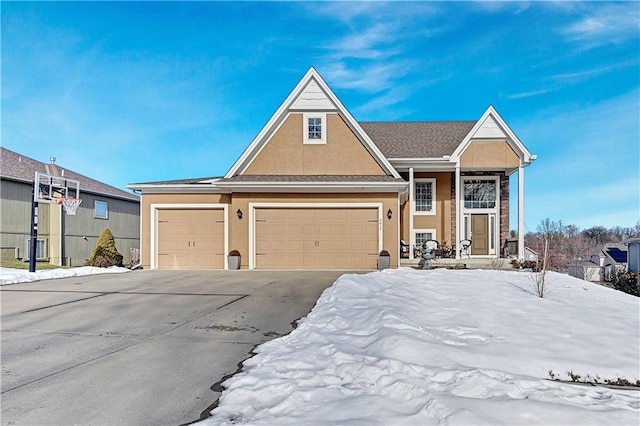 view of front of property featuring concrete driveway and stucco siding