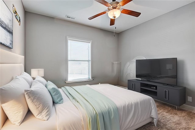 bedroom featuring carpet flooring, visible vents, and a ceiling fan