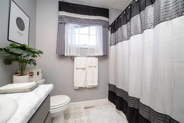 bathroom with visible vents, baseboards, toilet, curtained shower, and vanity