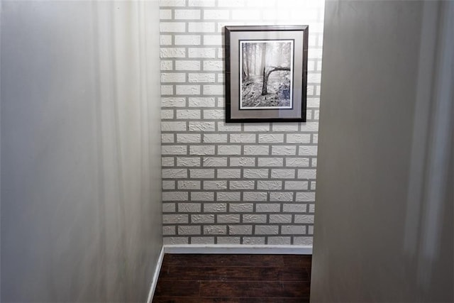 details featuring baseboards and wood finished floors