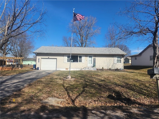 view of front facade featuring aphalt driveway, a front yard, and an attached garage