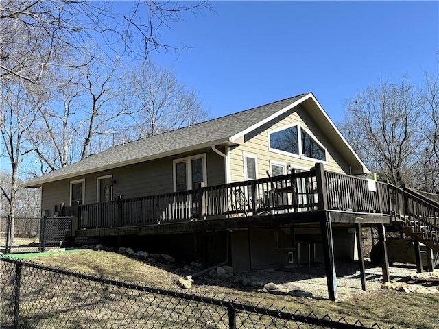 170 Paddle Boat Ln, Linn Valley, KS 66040 - view of side of home featuring stairs, fence, roof with shingles, and a wooden deck