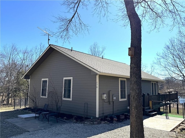 170 Paddle Boat Ln, Linn Valley, KS 66040 - view of side of property with a wooden deck, a shingled roof, and a patio area