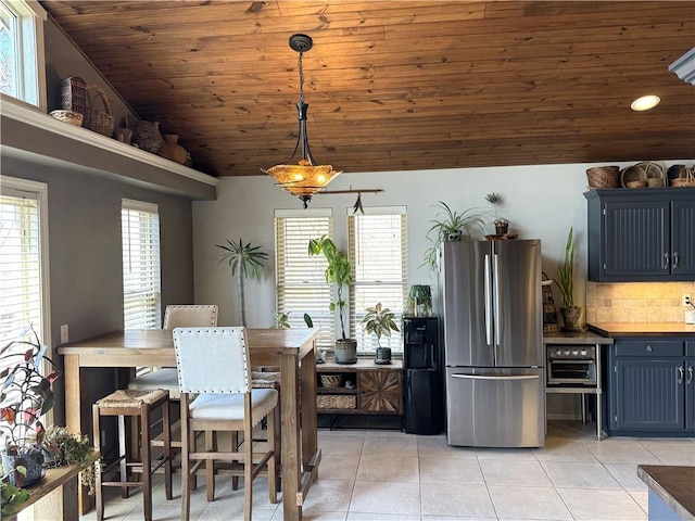 170 Paddle Boat Ln, Linn Valley, KS 66040 - dining room with lofted ceiling, light tile patterned floors, and wood ceiling