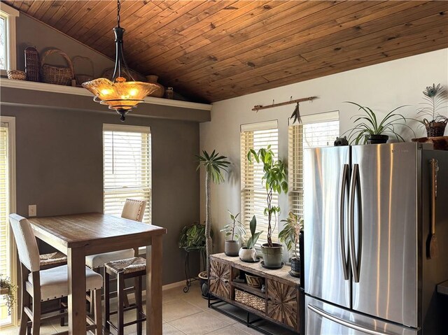 170 Paddle Boat Ln, Linn Valley, KS 66040 - dining area featuring light tile patterned floors, wood ceiling, a wealth of natural light, and vaulted ceiling