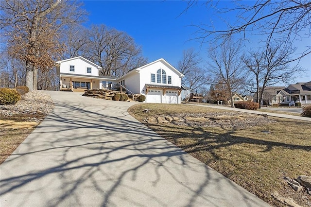 view of front of property featuring a garage and concrete driveway