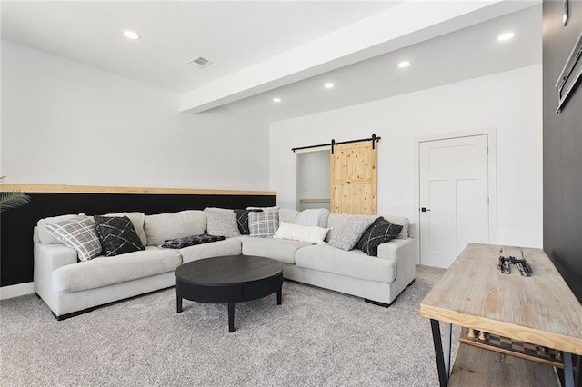 living room with visible vents, a barn door, beam ceiling, and recessed lighting