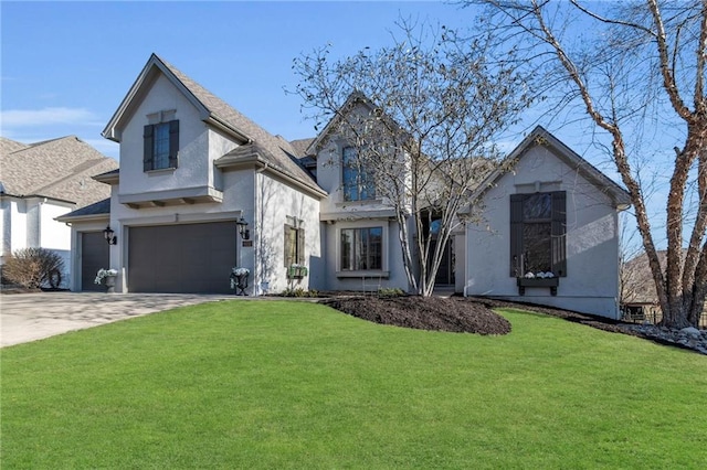 view of front of property featuring a garage, driveway, a front yard, and stucco siding