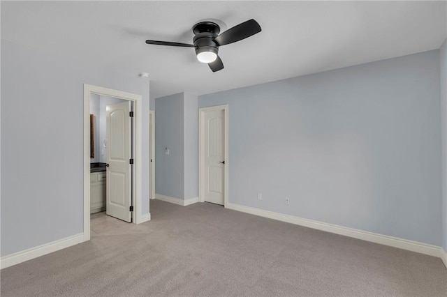 unfurnished bedroom featuring carpet flooring, a ceiling fan, and baseboards