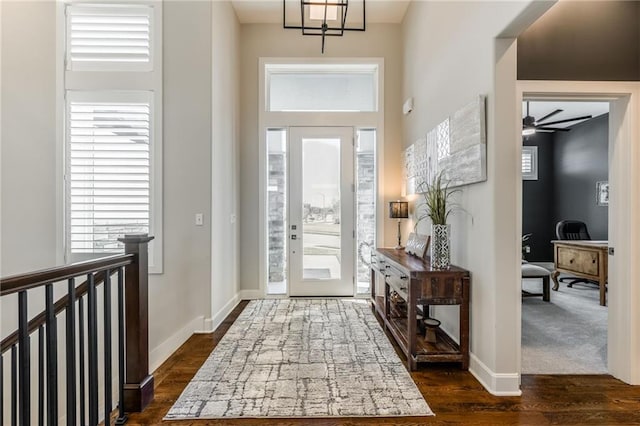 4510 NW 70th Ter, Kansas City, MO 64151 - entrance foyer with a wealth of natural light, baseboards, a ceiling fan, and dark wood-style flooring