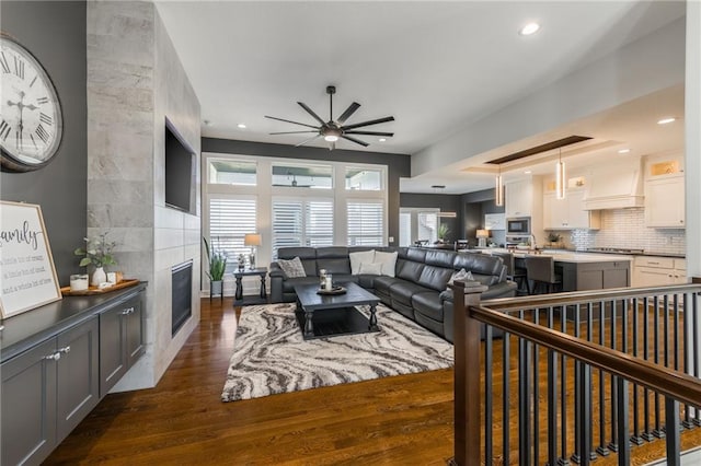 4510 NW 70th Ter, Kansas City, MO 64151 - living area with dark wood-style floors, recessed lighting, a fireplace, and ceiling fan