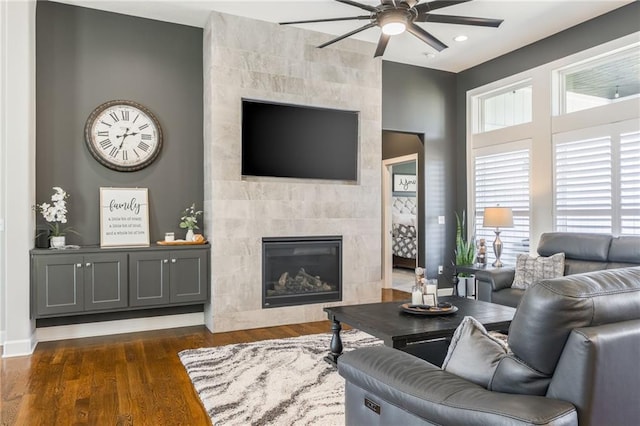 4510 NW 70th Ter, Kansas City, MO 64151 - living room with dark wood-style floors, recessed lighting, baseboards, ceiling fan, and a tile fireplace