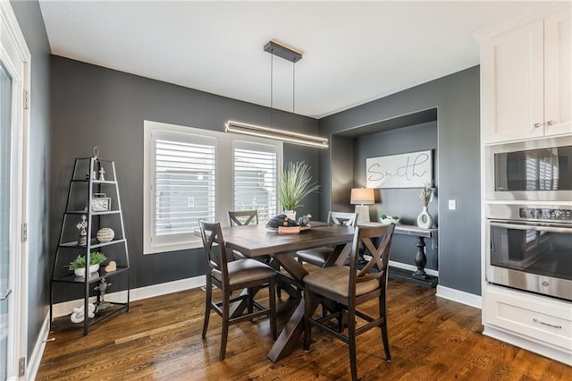 4510 NW 70th Ter, Kansas City, MO 64151 - dining area featuring dark wood-style floors and baseboards