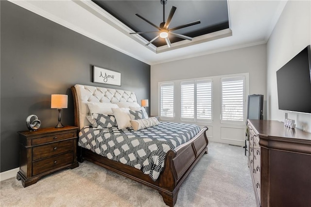 4510 NW 70th Ter, Kansas City, MO 64151 - carpeted bedroom featuring a ceiling fan, crown molding, and a tray ceiling