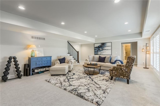 4510 NW 70th Ter, Kansas City, MO 64151 - carpeted living room featuring stairway, recessed lighting, visible vents, and baseboards