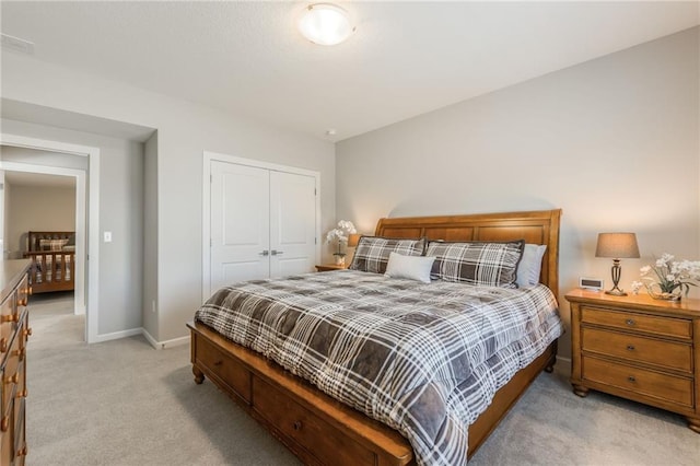 4510 NW 70th Ter, Kansas City, MO 64151 - bedroom featuring a closet, visible vents, light colored carpet, and baseboards