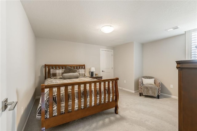 4510 NW 70th Ter, Kansas City, MO 64151 - carpeted bedroom featuring visible vents, baseboards, and a textured ceiling