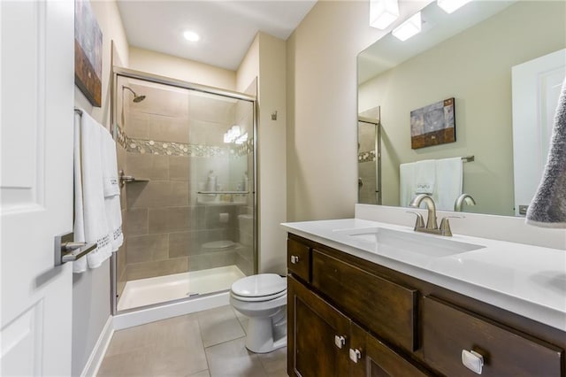 4510 NW 70th Ter, Kansas City, MO 64151 - bathroom with tile patterned flooring, a stall shower, toilet, and vanity