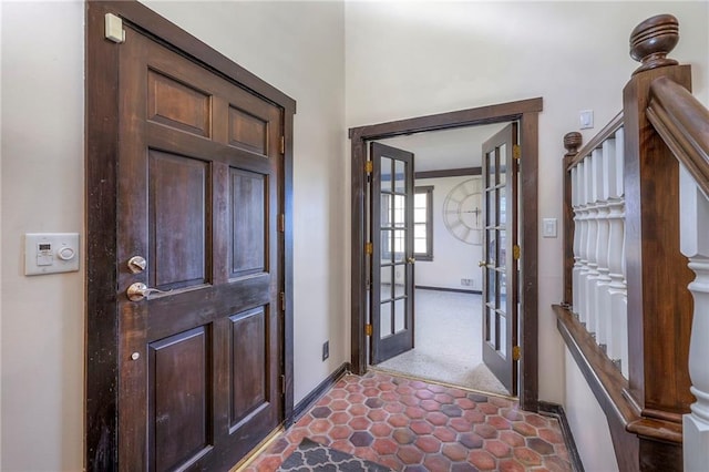 entrance foyer with french doors, stairway, and baseboards