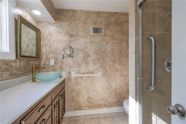 full bath with a stall shower, visible vents, toilet, tile patterned flooring, and vanity