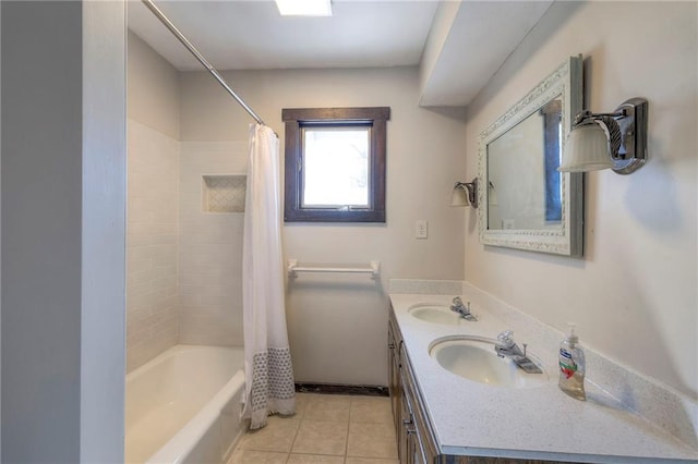 full bathroom featuring double vanity, shower / bath combination with curtain, a sink, and tile patterned floors